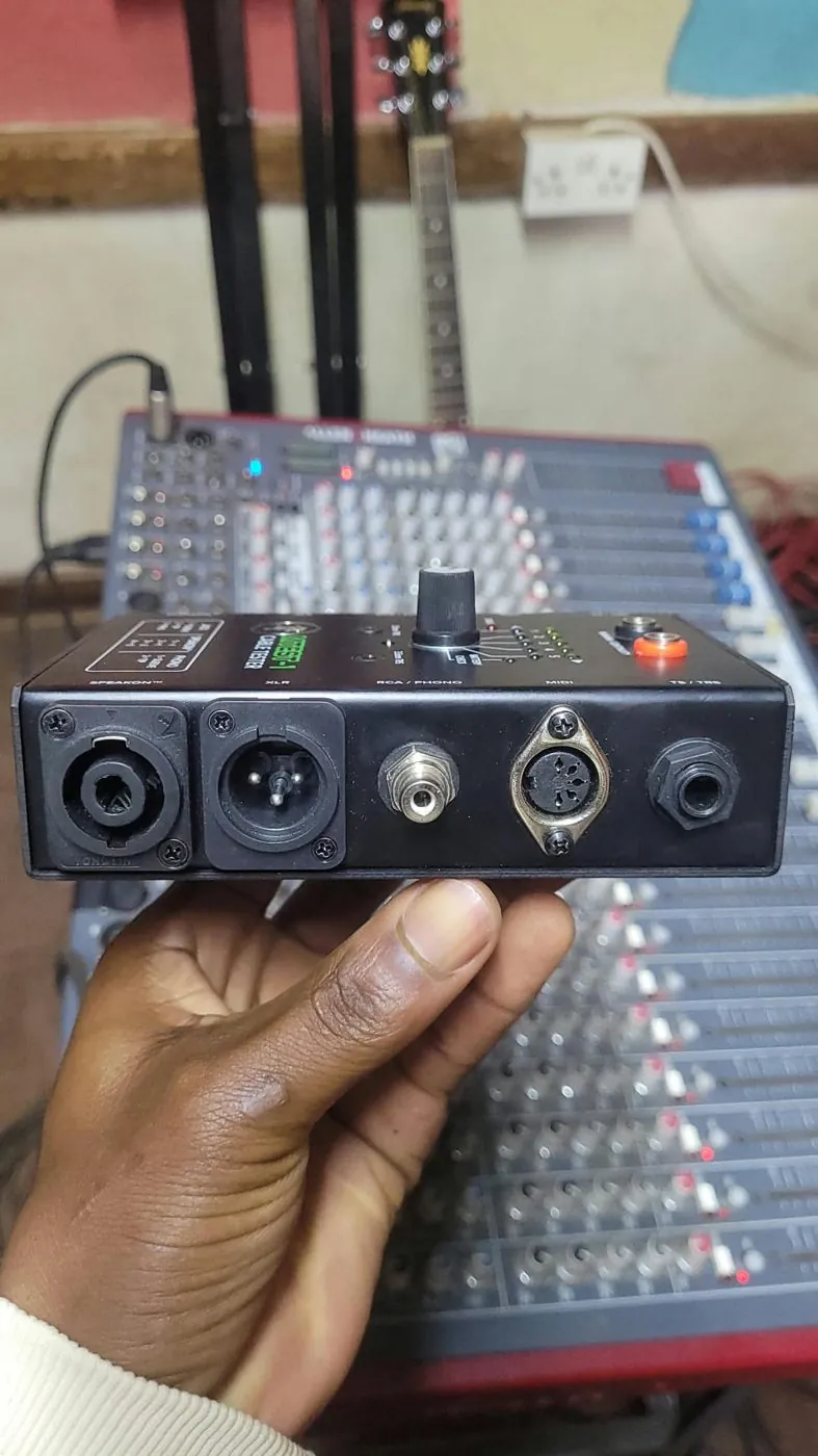 Testing a cable with a handheld tester at the mixer